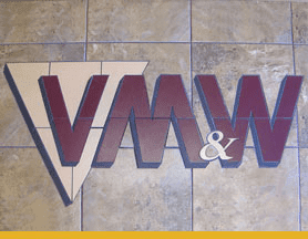 VMW & W logo displayed prominently on tiled wall