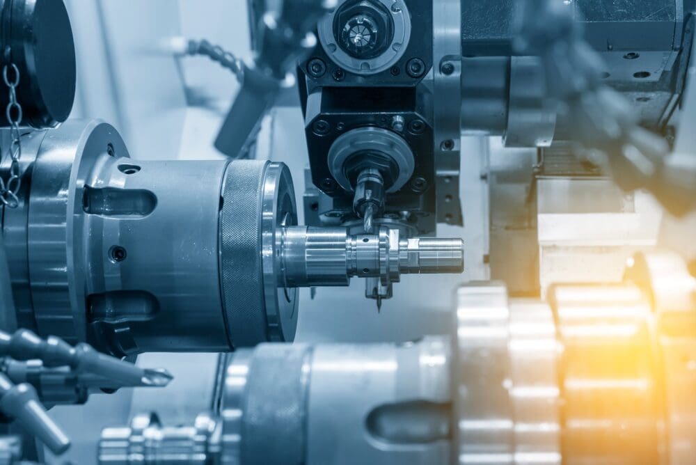 The CNC lathe milling the steel shaft